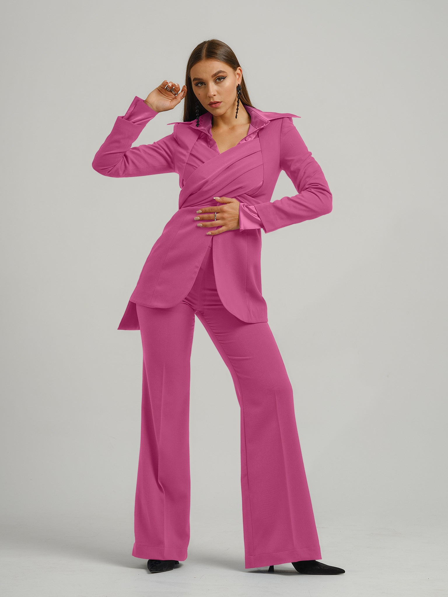 Tia Dorraine Sweet Desire Statement Cross Wrap Blazer This thigh-length design reimagines the classic blazer with a generous helping of creative flair. The piece features an impressive cross drape panels that create a sweetheart neckline when tied at the