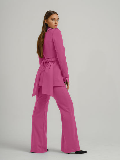 Tia Dorraine Sweet Desire Statement Cross Wrap Blazer This thigh-length design reimagines the classic blazer with a generous helping of creative flair. The piece features an impressive cross drape panels that create a sweetheart neckline when tied at the