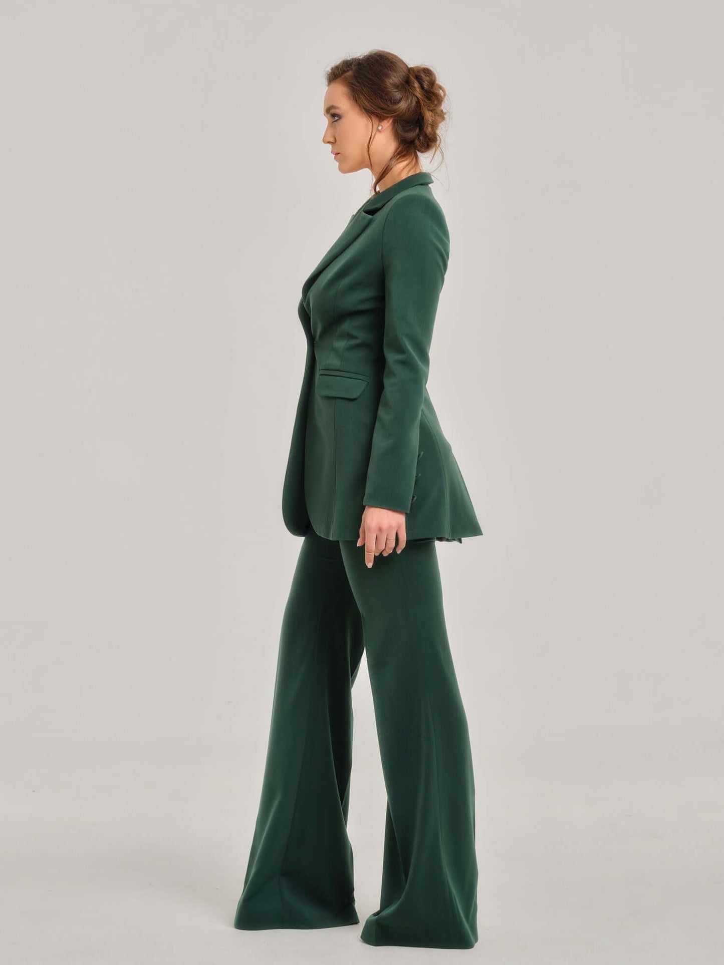 Tia Dorraine Emerald Dream Timeless Classic Blazer The thigh-length blazer is one of our favourite pieces. This statement piece features a single large button closure that emphasizes its streamlined design. It stands out with its structured shoulders, bea