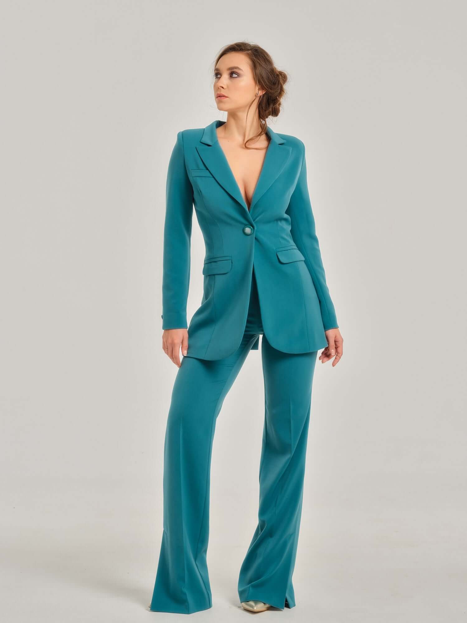 Tia Dorraine Magic Hour Timeless Classic Blazer This statement features a single large button closure that emphasizes its streamlined design. It stands out with its structured shoulders, beautiful princess seams, and waist darts, giving you the perfect sh