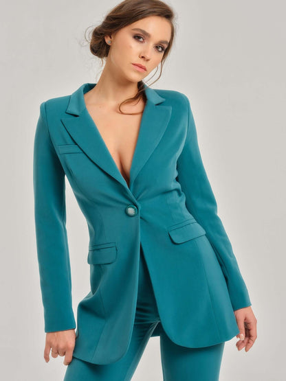 Tia Dorraine Magic Hour Timeless Classic Blazer This statement features a single large button closure that emphasizes its streamlined design. It stands out with its structured shoulders, beautiful princess seams, and waist darts, giving you the perfect sh
