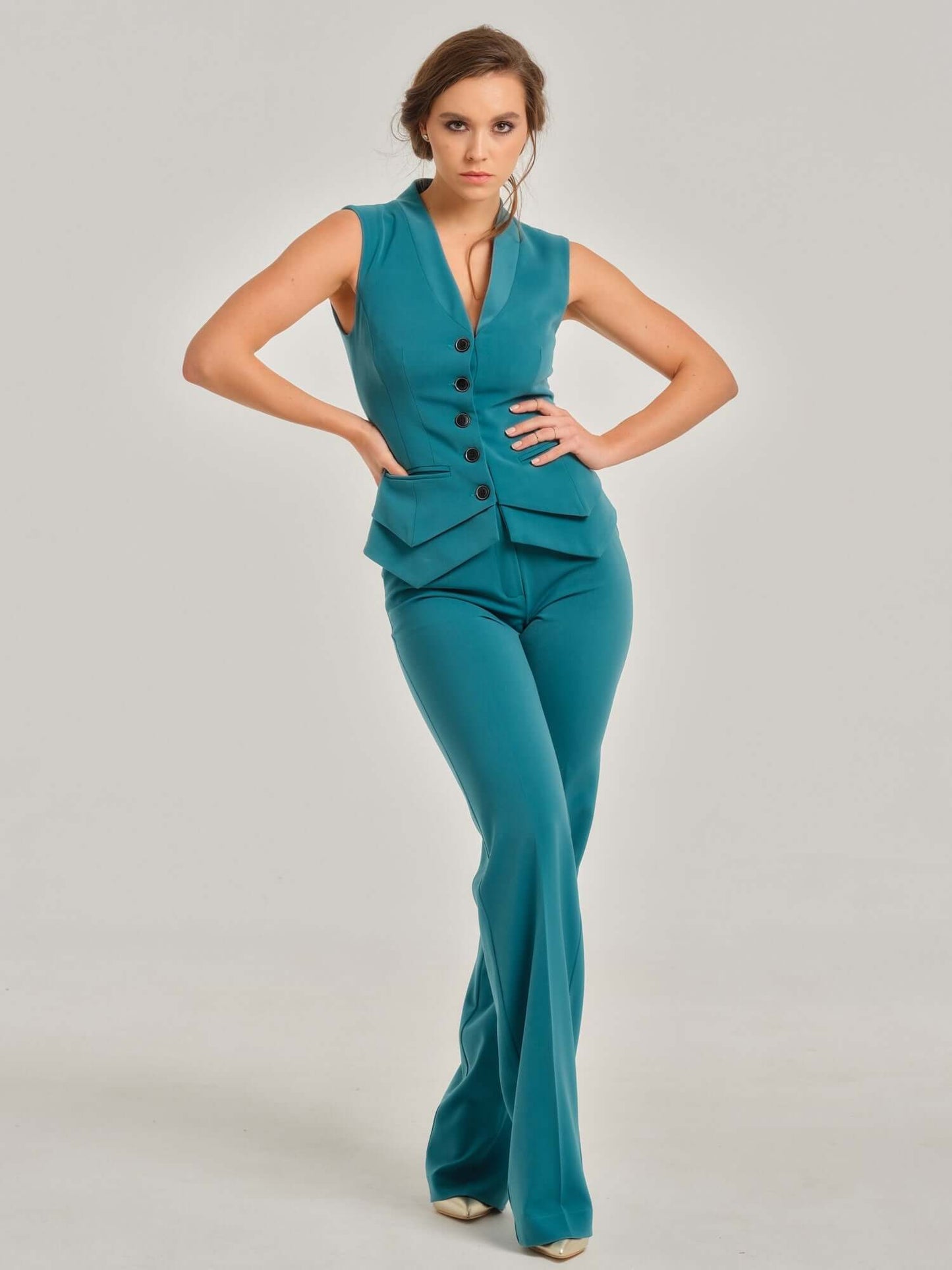 Tia Dorraine Magic Hour Straight-Leg Trousers These classic straight-leg turquoise trousers are an essential piece for the modern businesswoman's wardrobe. The fabric provides the right level of stretch for this piece to become your favourite garment for