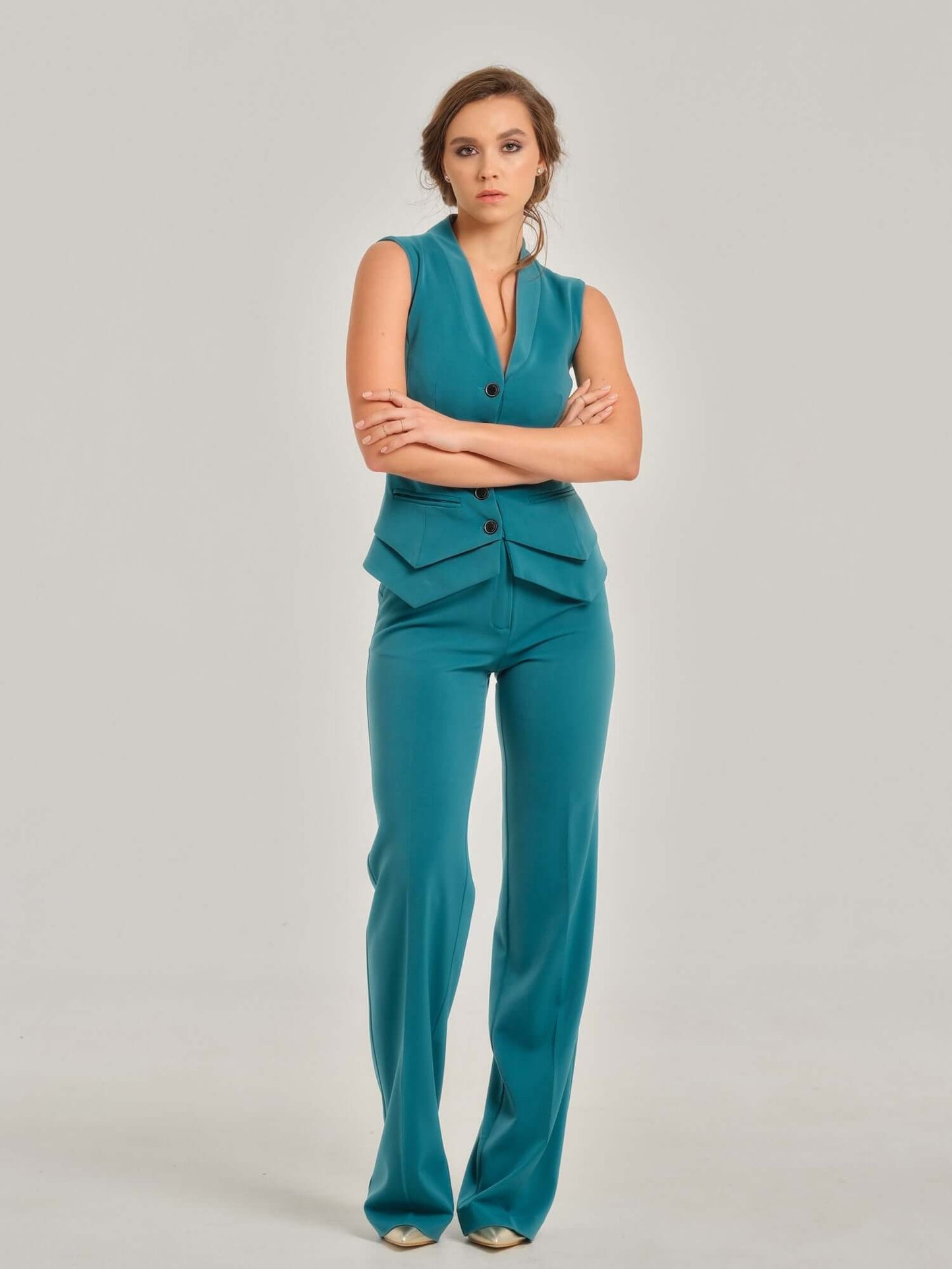 Tia Dorraine Magic Hour Straight-Leg Trousers These classic straight-leg turquoise trousers are an essential piece for the modern businesswoman's wardrobe. The fabric provides the right level of stretch for this piece to become your favourite garment for