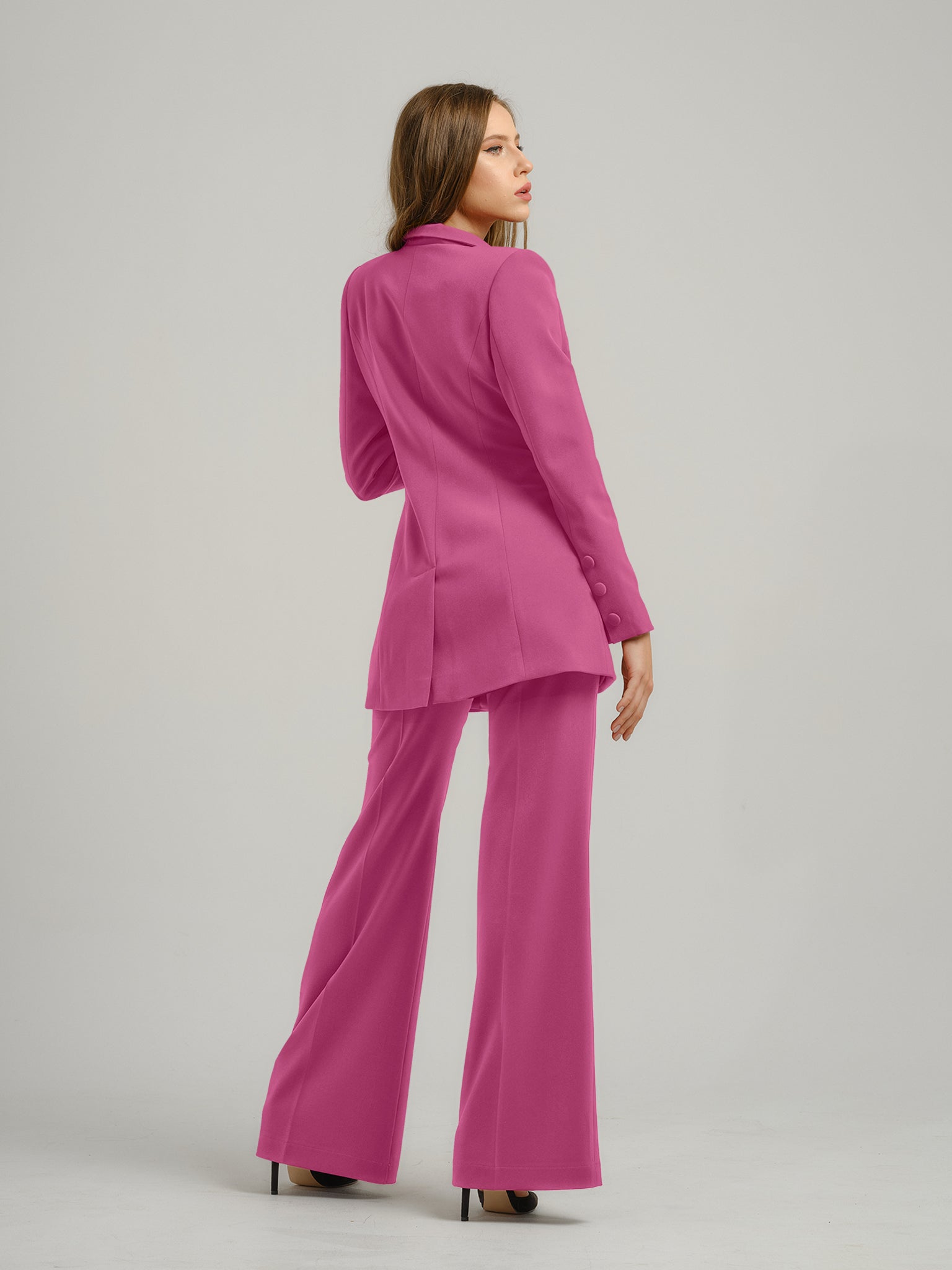 Tia Dorraine Sweet Desire High-Waist Flared Trousers These classic flared trousers would fit perfectly in any woman’s capsule wardrobe. With their full length, they can be worn with heeled boots or high heels in the office. The trousers feature a classic