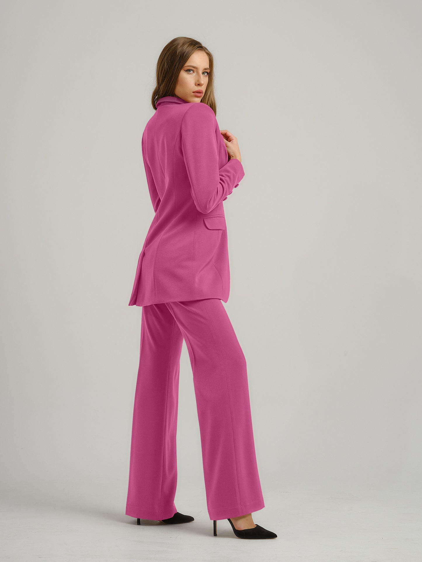 Tia Dorraine Sweet Desire High-Waist Flared Trousers These classic flared trousers would fit perfectly in any woman’s capsule wardrobe. With their full length, they can be worn with heeled boots or high heels in the office. The trousers feature a classic
